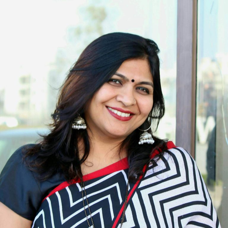 A warm, professional photo of Sejal Waghmare